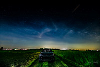 BMW in a field under the Milky Way